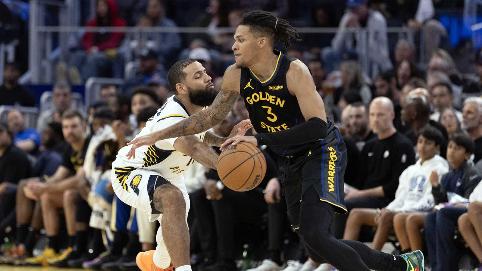 Golden State Warriors guard Will Richard (3) drives around Indiana Pacers forward Cody Martin (11) during the third quarter at Chase Center. 