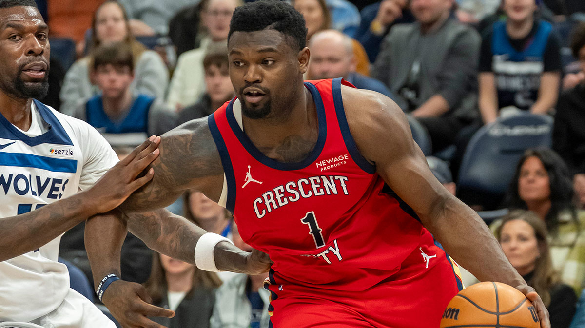New Orleans Pelicans forward Zion Williamson (1) drives to the basket past Minnesota Timberwolves center Naz Reid (11) in the second half at Target Center.