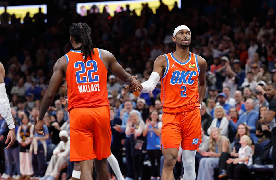 Nov 26, 2025; Oklahoma City, Oklahoma, USA; Oklahoma City Thunder guard Shai Gilgeous-Alexander (2) high fives Oklahoma City Thunder guard Cason Wallace (22) after a play against the Minnesota Timberwolves during the second half at Paycom Center. Mandatory Credit: Alonzo Adams-Imagn Images