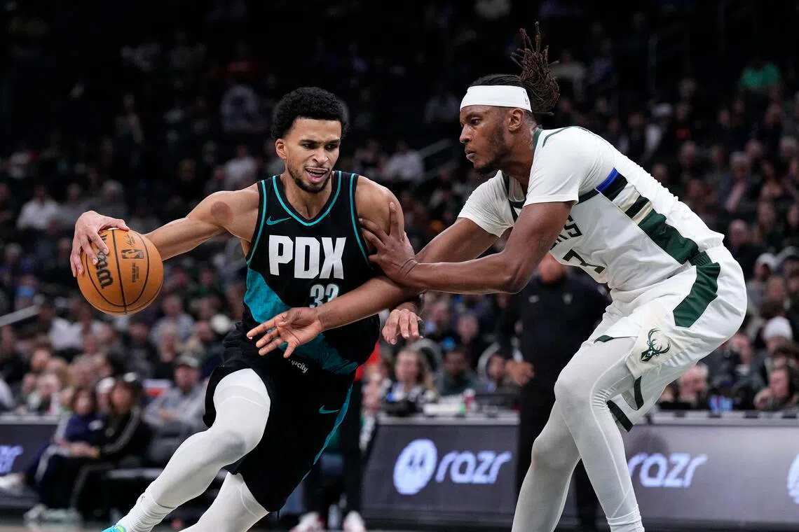 Portland Trail Blazers forward Toumani Camara drives against Milwaukee Bucks center Myles Turner in the second half at Fiserv Forum.