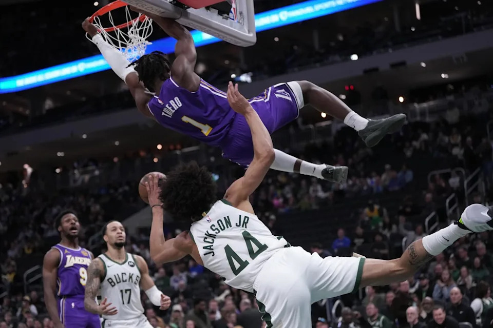 Lakers forward Adou Thiero dunks past the Bucks' Andre Jackson Jr. during the second half Saturday.