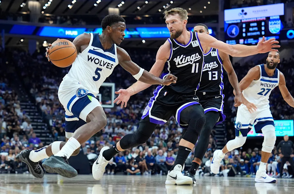 SACRAMENTO, CALIFORNIA – OCTOBER 24: Anthony Edwards #5 of the Minnesota Timberwolves dribbling the ball is guarded by Domantas Sabonis #11 of the Sacramento Kings during the second quarter of an NBA basketball game at Golden 1 Center on October 24, 2024 in Sacramento, California. NOTE TO USER: User expressly acknowledges and agrees that, by downloading and or using this photograph, User is consenting to the terms and conditions of the Getty Images License Agreement. (Photo by Thearon W. Henderson/Getty Images)