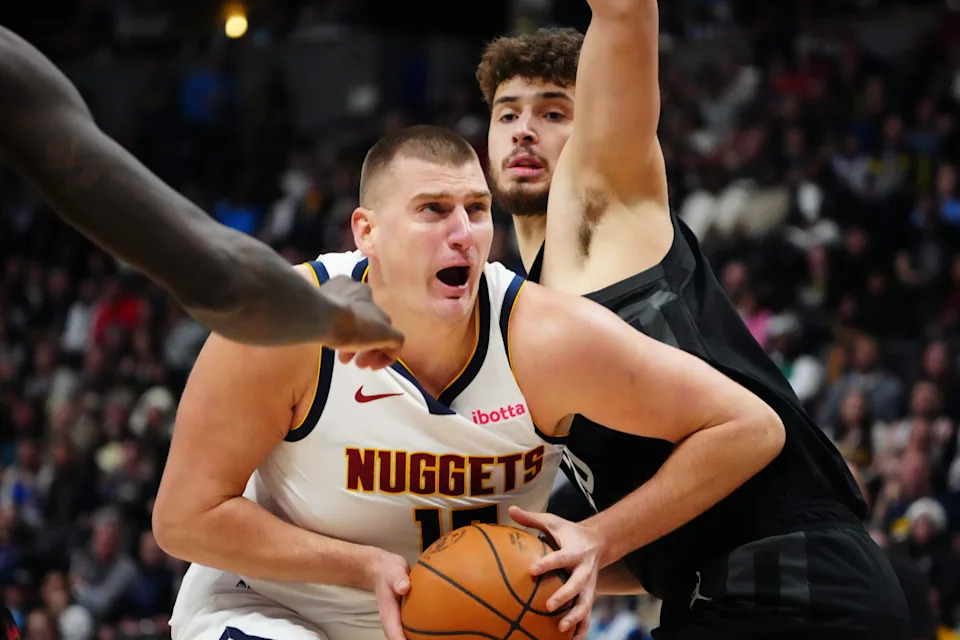 Dec 8, 2023; Denver, Colorado, USA; Denver Nuggets center Nikola Jokic (15) drives past Houston Rockets center Alperen Sengun (28) in the second half at Ball Arena. Mandatory Credit: Ron Chenoy-USA TODAY Sports
