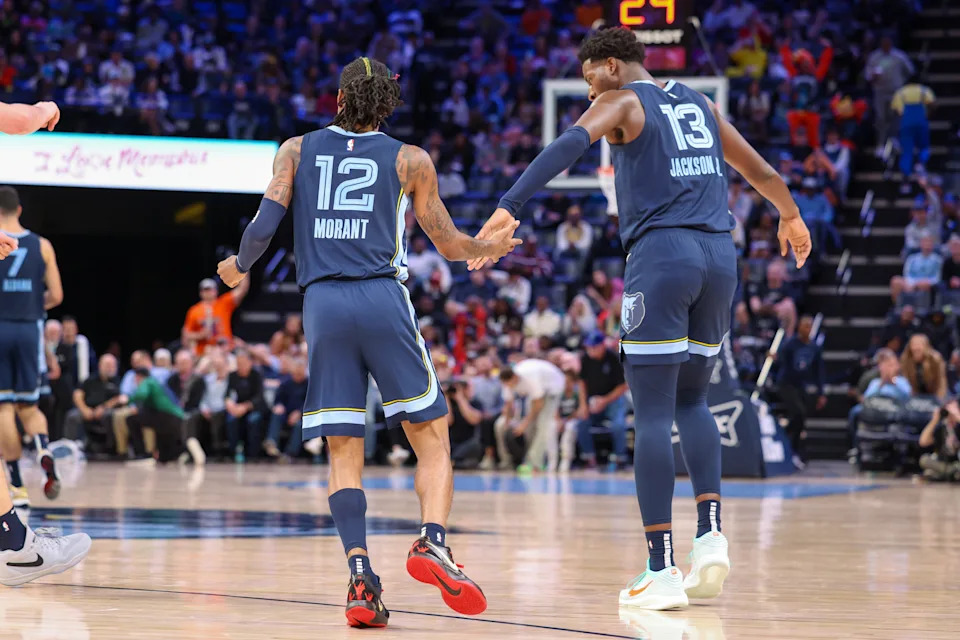 MEMPHIS, TENNESSEE - OCTOBER 31: Ja Morant #12 and Jaren Jackson Jr. #13 of the Memphis Grizzlies high five during the second half against the Milwaukee Bucks at FedExForum on October 31, 2024 in Memphis, Tennessee. NOTE TO USER: User expressly acknowledges and agrees that, by downloading and or using this Photograph, user is consenting to the terms and conditions of the Getty Images License Agreement. (Photo by Wes Hale/Getty Images)