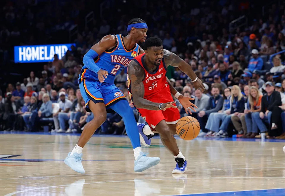 Nov 2, 2025; Oklahoma City, Oklahoma, USA; New Orleans Pelicans forward Zion Williamson (1) moves past Oklahoma City Thunder guard Shai Gilgeous-Alexander (2) on a drive to the basket during the second half at Paycom Center. Mandatory Credit: Alonzo Adams-Imagn Images