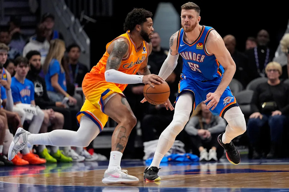 Nov 15, 2025; Charlotte, North Carolina, USA; Charlotte Hornets forward Miles Bridges (0) handles the ball against Oklahoma City Thunder center Isaiah Hartenstein (55) during the second half at Spectrum Center. Mandatory Credit: Jim Dedmon-Imagn Images