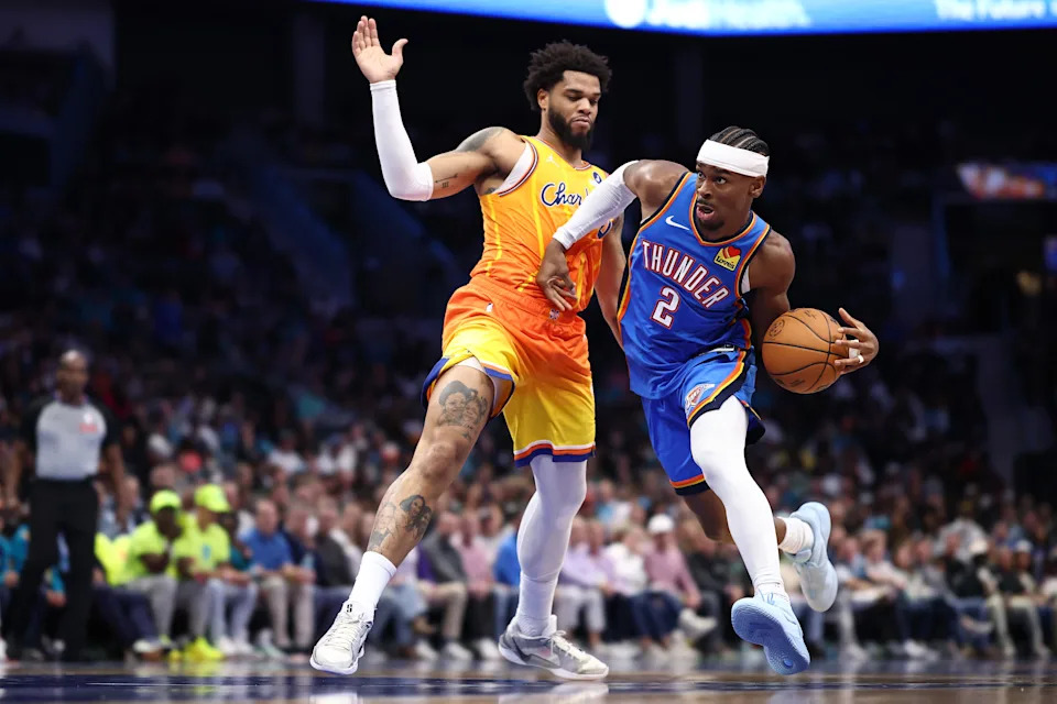 CHARLOTTE, NORTH CAROLINA - NOVEMBER 15: Shai Gilgeous-Alexander #2 of the Oklahoma City Thunder drives to the basket against Miles Bridges #0 of the Charlotte Hornets during the second quarter of the game at Spectrum Center on November 15, 2025 in Charlotte, North Carolina. NOTE TO USER: User expressly acknowledges and agrees that, by downloading and or using this photograph, User is consenting to the terms and conditions of the Getty Images License Agreement. (Photo by Jared C. Tilton/Getty Images)