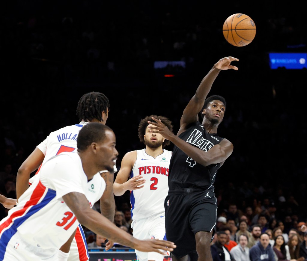 Nets guard Drake Powell looks to pass over a defending against the Detroit Pistons defense in the first half at the Barclays Center in Brooklyn, New York, November 07, 2025.