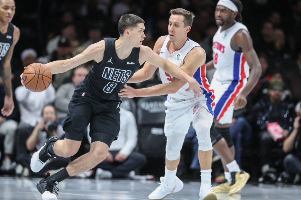 Brooklyn Nets guard Egor Demin dribbling past Detroit Pistons forward Duncan Robinson.