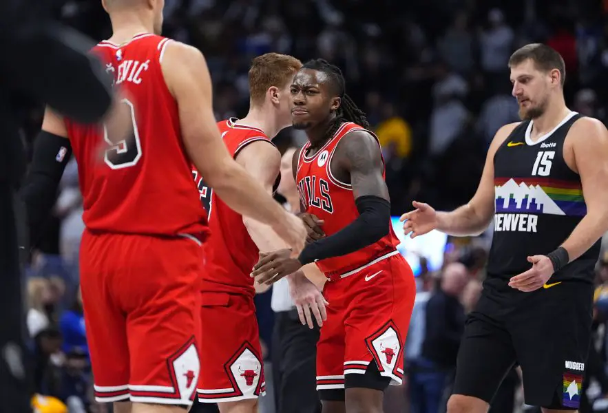 Nov 17, 2025; Denver, Colorado, USA; Chicago Bulls forward/center Jalen Smith (25) defends on Denver Nuggets center Nikola Jokic (15) in the second half at Ball Arena. Mandatory Credit: Ron Chenoy-Imagn Images