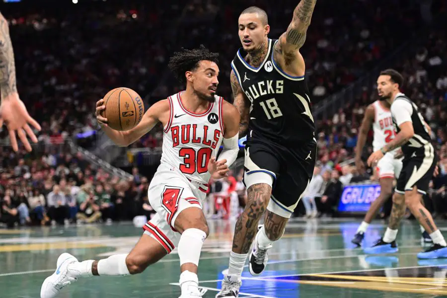 Nov 7, 2025; Milwaukee, Wisconsin, USA; Chicago Bulls guard Tre Jones (30) drives for the basket against Milwaukee Bucks forward Kyle Kuzma (18) in the second quarter at Fiserv Forum. Mandatory Credit: Benny Sieu-Imagn Images