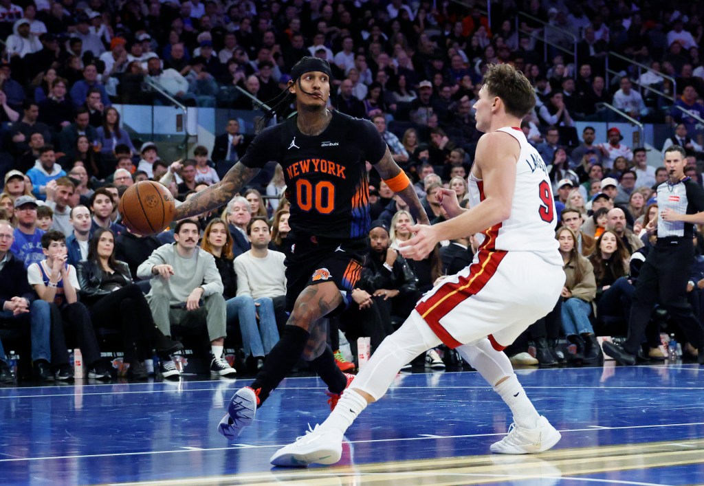 New York Knicks guard Jordan Clarkson drives the ball past Miami Heat guard Pelle Larsson.