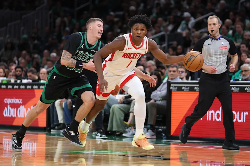 Nov 1, 2025; Boston, Massachusetts, USA; Houston Rockets forward Amen Thompson (1) dribbles down the court defended by Boston Celtics guard Baylor Scheierman (55) during the second half at TD Garden. Mandatory Credit: Paul Rutherford-Imagn Images
