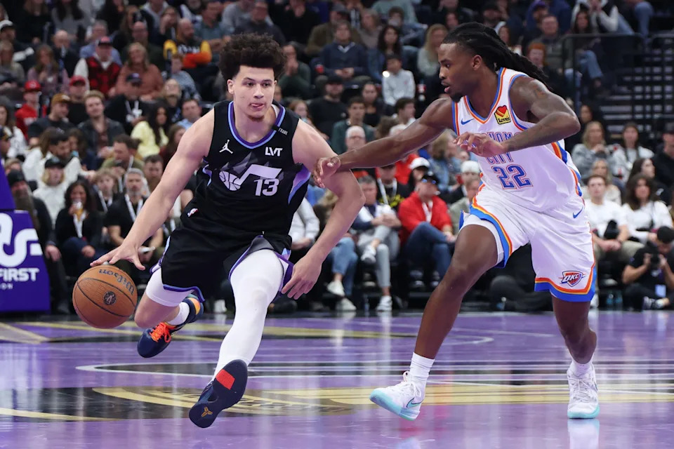 Nov 21, 2025; Salt Lake City, Utah, USA; Utah Jazz guard Walter Clayton Jr. (13) brings the ball up the court against Oklahoma City Thunder guard Cason Wallace (22) during the second half at Delta Center. Mandatory Credit: Rob Gray-Imagn Images