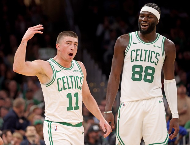 Payton Pritchard (11) of the Boston Celtics gets the fans going as Neemias Queta looks on during the first half during an easy win over Washington at the TD Garden. (Photo By Matt Stone/Boston Herald)