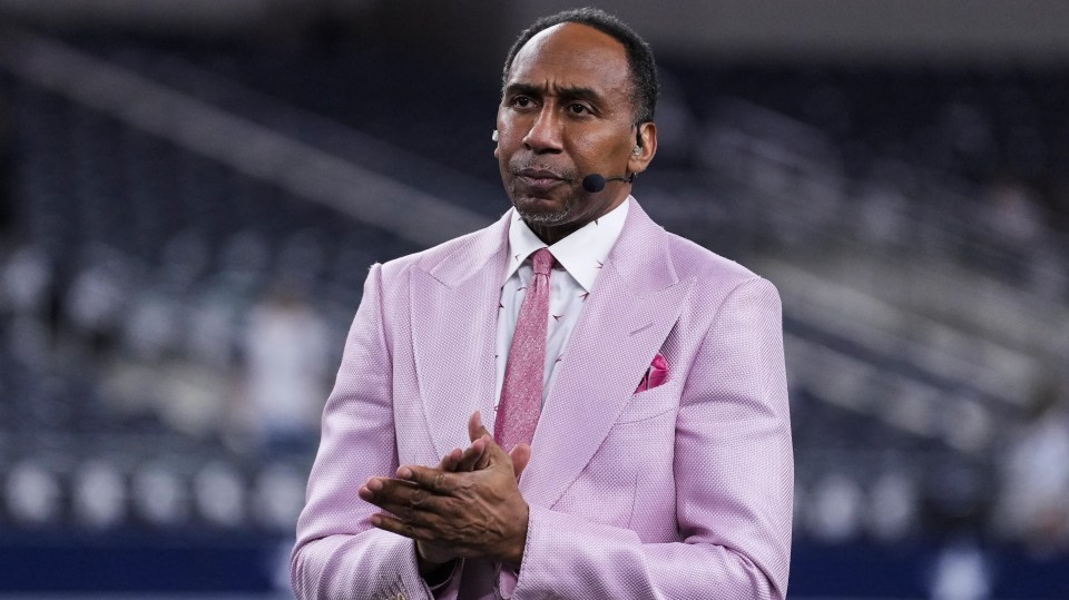 Stephen A. Smith looks on from the field during warmups prior to an NFL football game between the Arizona Cardinals and the Dallas Cowboys