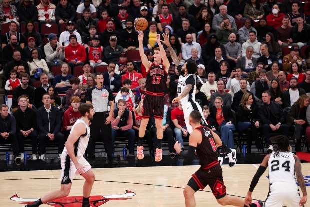Chicago Bulls guard Kevin Huerter (13) shoots a 3-point shot during the first quarter against the San Antonio Spurs at the United Center on Monday, Nov. 10, 2025, in Chicago. (Armando L. Sanchez/Chicago Tribune)