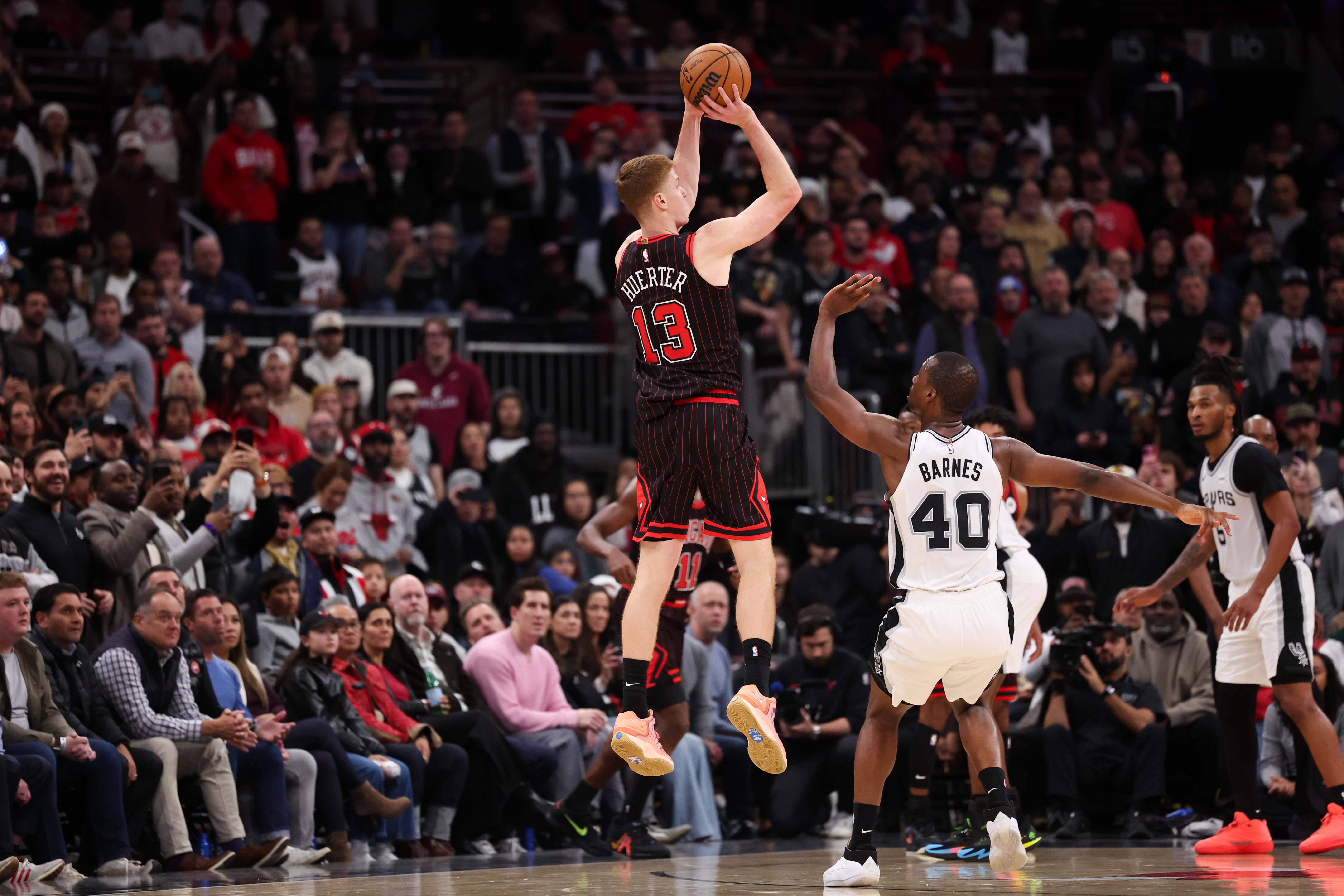 Chicago Bulls guard Kevin Huerter (13) goes up but fails to make a 3-point shot near the end of the fourth quarter against the San Antonio Spurs at the United Center on Monday, Nov. 10, 2025, in Chicago. (Armando L. Sanchez/Chicago Tribune)