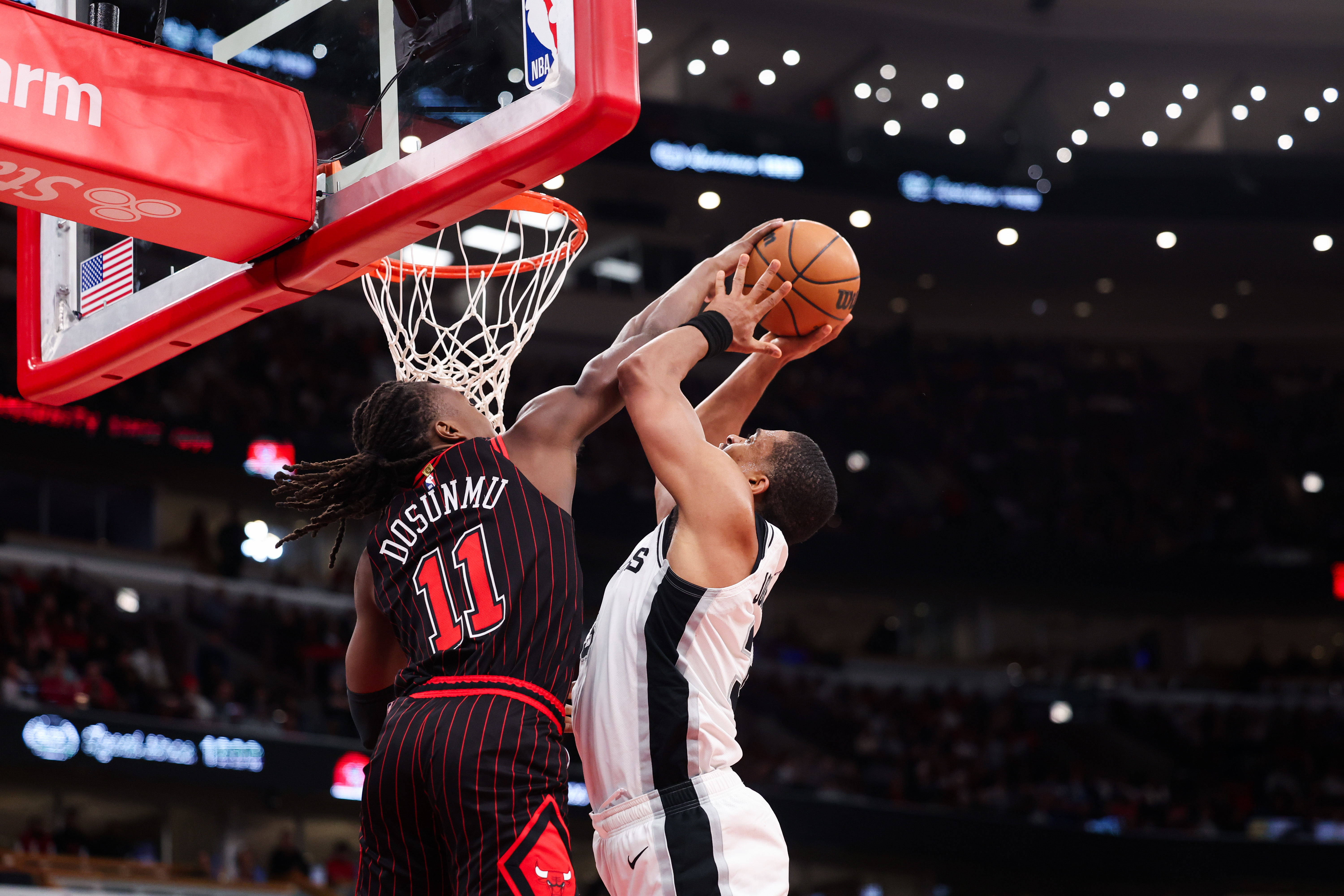 Chicago Bulls guard Ayo Dosunmu (11) guards San Antonio Spurs forward Keldon Johnson (3) during the fourth quarter at the United Center on Monday, Nov. 10, 2025, in Chicago. (Armando L. Sanchez/Chicago Tribune)