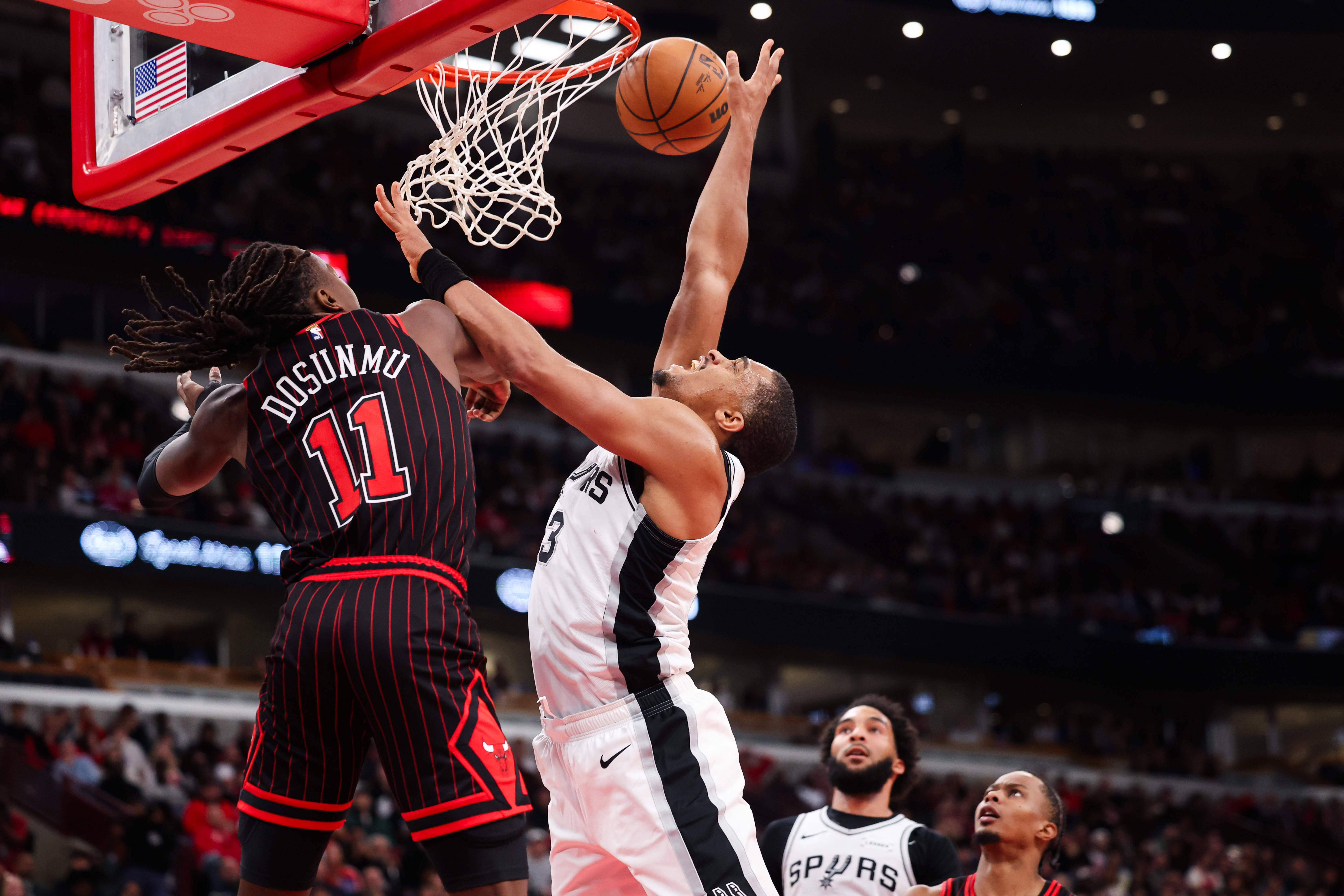 Chicago Bulls guard Ayo Dosunmu (11) guards San Antonio Spurs forward Keldon Johnson (3) during the fourth quarter at the United Center on Monday, Nov. 10, 2025, in Chicago. (Armando L. Sanchez/Chicago Tribune)