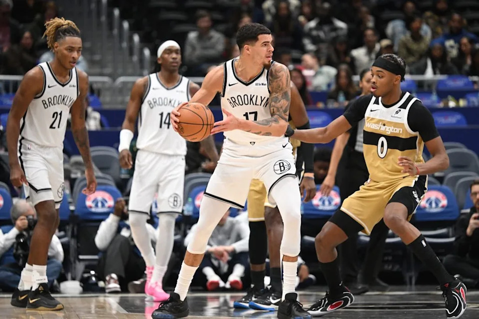 Nets forward Michael Porter Jr. (17) looks to pass the ball infant to Washington Wizards guard Bilal Coulibaly (0) during the third quarter at Capital One Arena. Rafael Suanes-Imagn Images