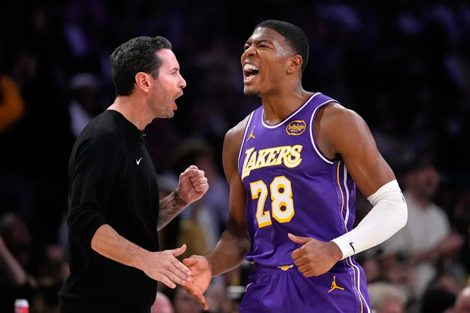 Lakers forward Rui Hachimura, right, celebrates with coach JJ Redick during the second half of Wednesday's game.