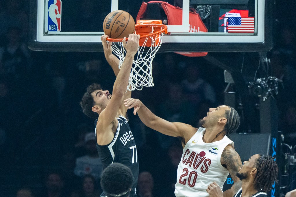 Brooklyn Nets guard Ben Saraf (77) shoots while Cleveland Cavaliers guard Jaylon Tyson (20) defends.