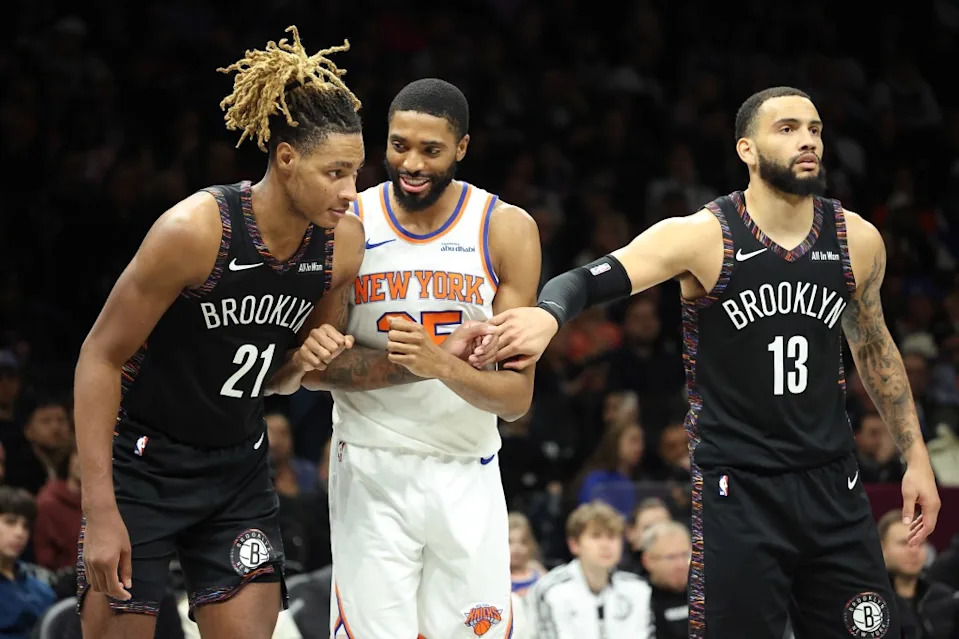 Mikal Bridges #25 of the New York Knicks jokes around with Noah Clowney #21 of the Brooklyn Nets during the third quarter.<br><br> Charles Wenzelberg for The New York Post