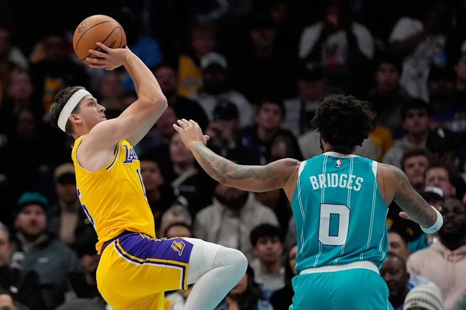 Lakers guard Austin Reaves shoots over Charlotte Hornets forward Miles Bridges during the first half Monday.