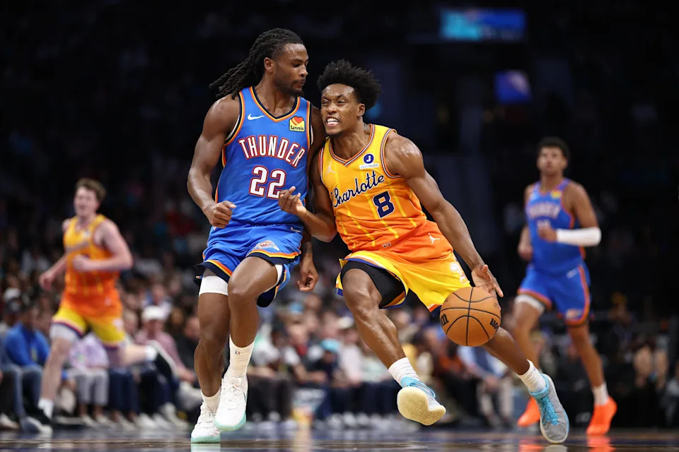 CHARLOTTE, NORTH CAROLINA - NOVEMBER 15: Collin Sexton #8 of the Charlotte Hornets drives to the basket against Cason Wallace #22 of the Oklahoma City Thunder during the second half of the game at Spectrum Center on November 15, 2025 in Charlotte, North Carolina. NOTE TO USER: User expressly acknowledges and agrees that, by downloading and or using this photograph, User is consenting to the terms and conditions of the Getty Images License Agreement. (Photo by Jared C. Tilton/Getty Images)