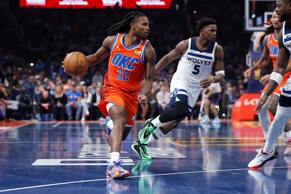 Nov 26, 2025; Oklahoma City, Oklahoma, USA; Oklahoma City Thunder guard Cason Wallace (22) drives past Minnesota Timberwolves guard Anthony Edwards (5) during the second quarter at Paycom Center. Mandatory Credit: Alonzo Adams-Imagn Images