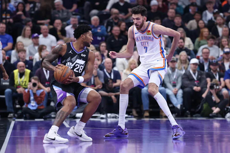Nov 21, 2025; Salt Lake City, Utah, USA; Utah Jazz forward Brice Sensabaugh (28) looks for the play against Oklahoma City Thunder center Chet Holmgren (7) during the first half at Delta Center. Mandatory Credit: Rob Gray-Imagn Images