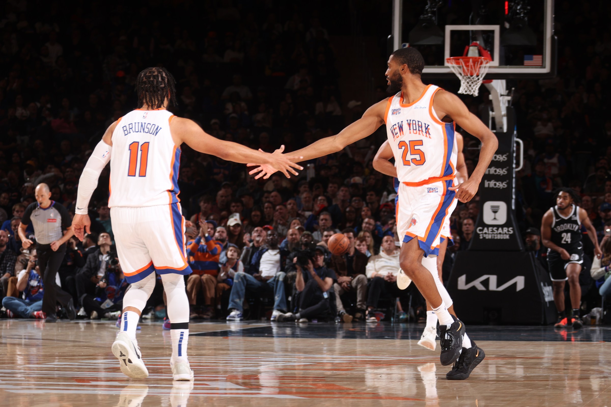 NEW YORK, NY - NOVEMBER 17: Jalen Brunson #11 and Mikal Bridges #25 of the New York Knicks high five during the game against the Brooklyn Nets on November 17, 2024 at Madison Square Garden in New York City, New York. NOTE TO USER: User expressly acknowledges and agrees that, by downloading and or using this photograph, User is consenting to the terms and conditions of the Getty Images License Agreement. Mandatory Copyright Notice: Copyright 2024 NBAE (Photo by Nathaniel S. Butler/NBAE via Getty Images)