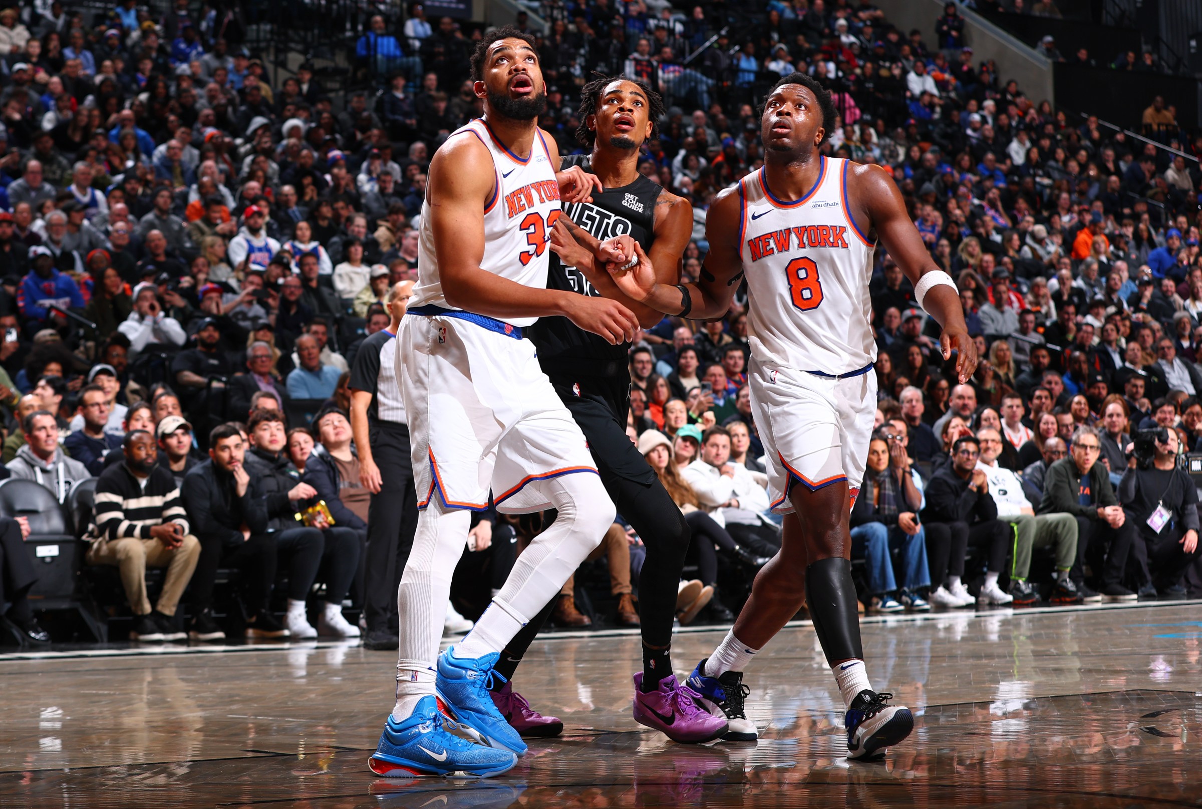 BROOKLYN, NY - JANUARY 21: Karl-Anthony Towns #32 of the New York Knicks, Nicolas Claxton #33 of the Brooklyn Nets, and OG Anunoby #8 of the New York Knicks waits for a rebound during the game on January 21, 2025 at Barclays Center in Brooklyn, New York. NOTE TO USER: User expressly acknowledges and agrees that, by downloading and or using this Photograph, user is consenting to the terms and conditions of the Getty Images License Agreement. Mandatory Copyright Notice: Copyright 2025 NBAE (Photo by David L. Nemec/NBAE via Getty Images)