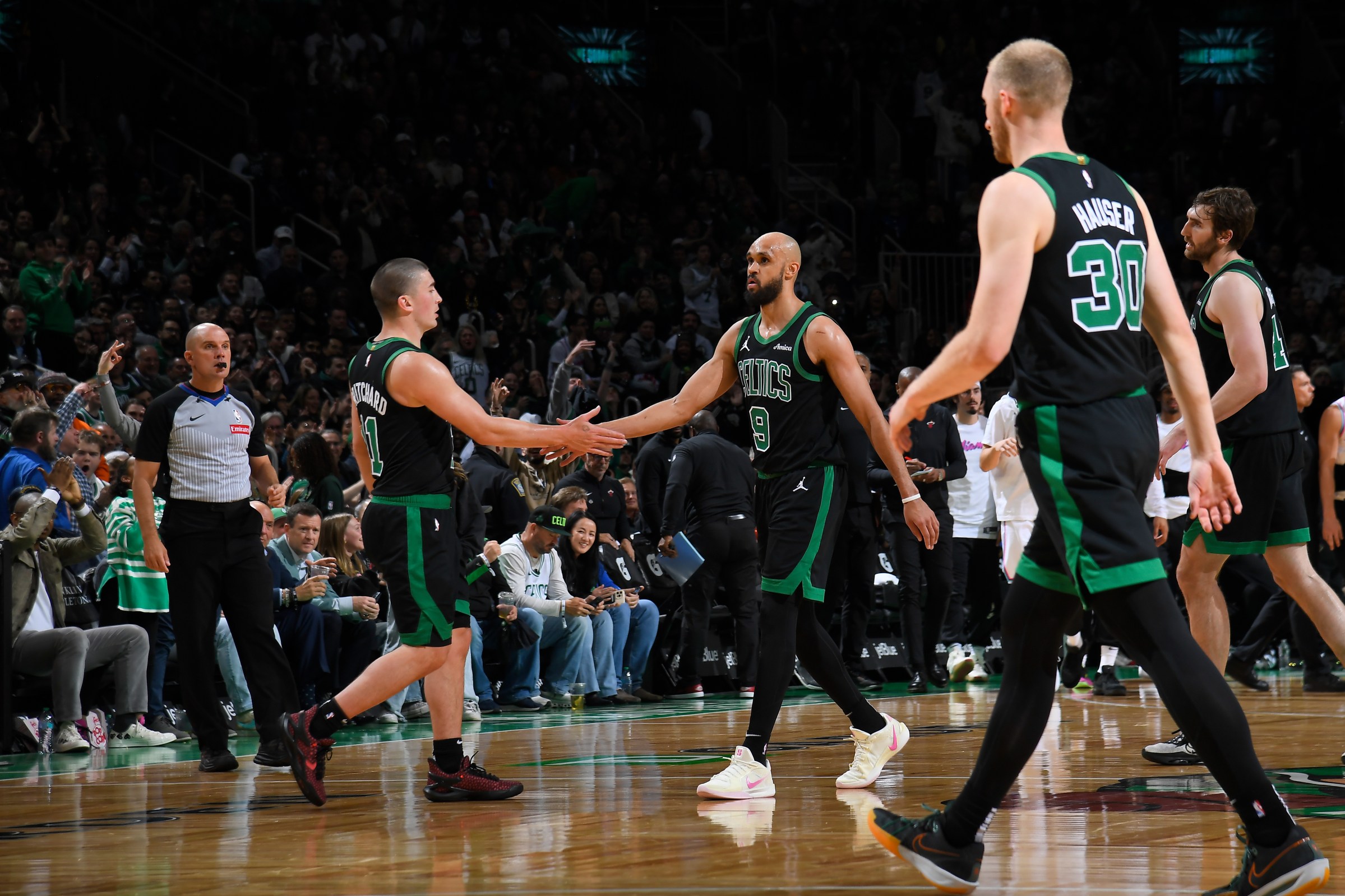 BOSTON, MA - APRIL 2: Payton Pritchard #11 of the Boston Celtics high fives Derrick White #9 during the game against the Miami Heat on April 2, 2025 at TD Garden in Boston, Massachusetts. NOTE TO USER: User expressly acknowledges and agrees that, by downloading and/or using this Photograph, user is consenting to the terms and conditions of the Getty Images License Agreement. Mandatory Copyright Notice: Copyright 2025 NBAE(Photo by Brian Babineau/NBAE via Getty Images)