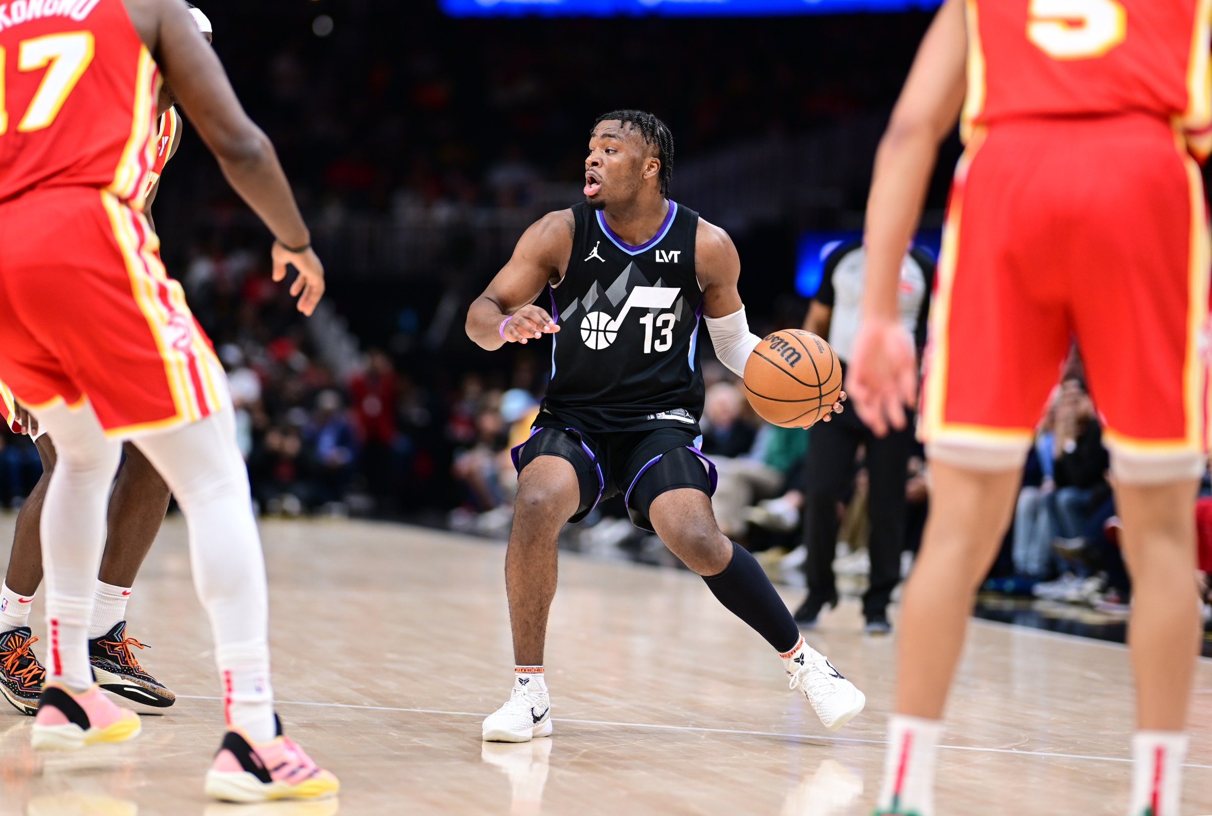 ATLANTA, GA - APRIL 6: Isaiah Collier #13 of the Utah Jazz looks to pass the ball during the game against the Atlanta Hawks on April 6, 2025 at State Farm Arena in Atlanta, Georgia. NOTE TO USER: User expressly acknowledges and agrees that, by downloading and/or using this Photograph, user is consenting to the terms and conditions of the Getty Images License Agreement. Mandatory Copyright Notice: Copyright 2025 NBAE (Photo by Adam Hagy/NBAE via Getty Images)