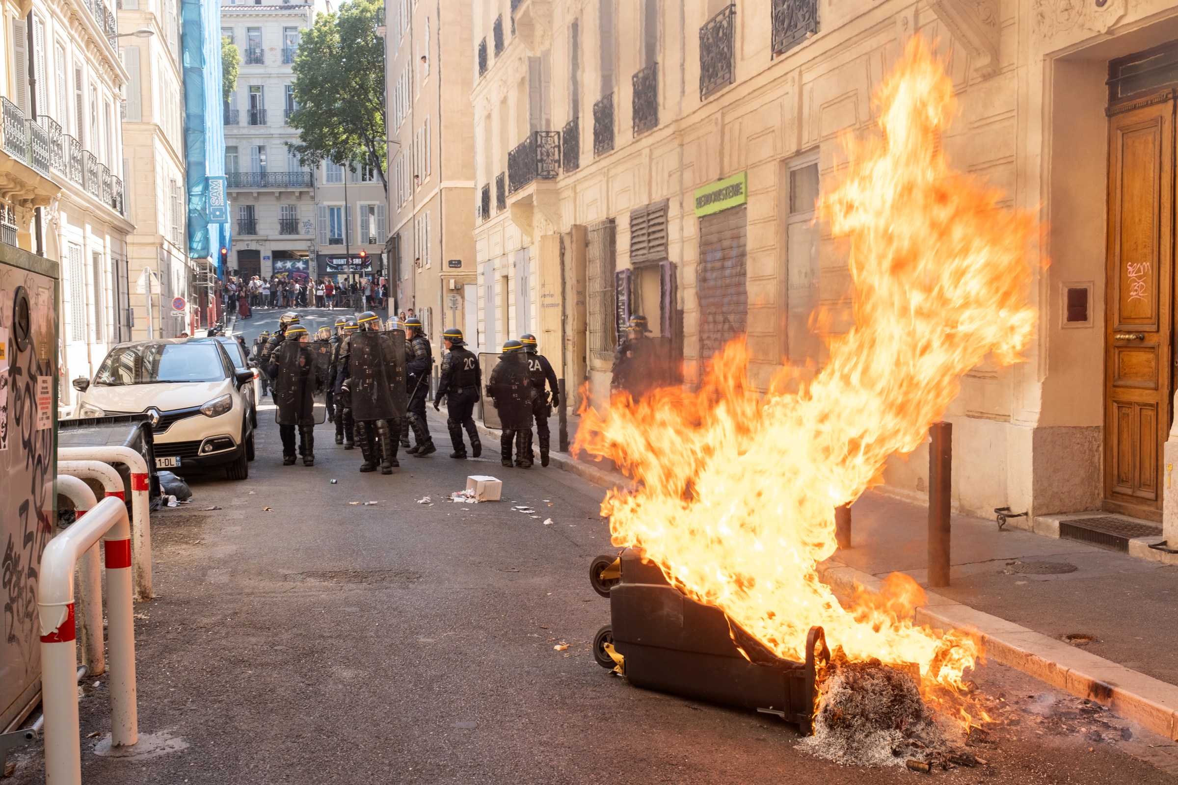 MARSEILLE, FRANCE - SEPTEMBER 10: Protesters set trash cans on fire and erect barricades in Reform Square on September 10, 2025 in Marseille, France. Various protest groups in France have called for the general strike on Wednesday under the slogan, Bloquons Tout (French for Block Everything) over the government’s proposed austerity measures to reduce the public debt. On Monday, French Prime Minister François Bayrou lost a vote of confidence after opposition party groups across the political spectrum opposed his unpopular budget. (Photo by Sener Yilmaz Aslan/Getty Images)