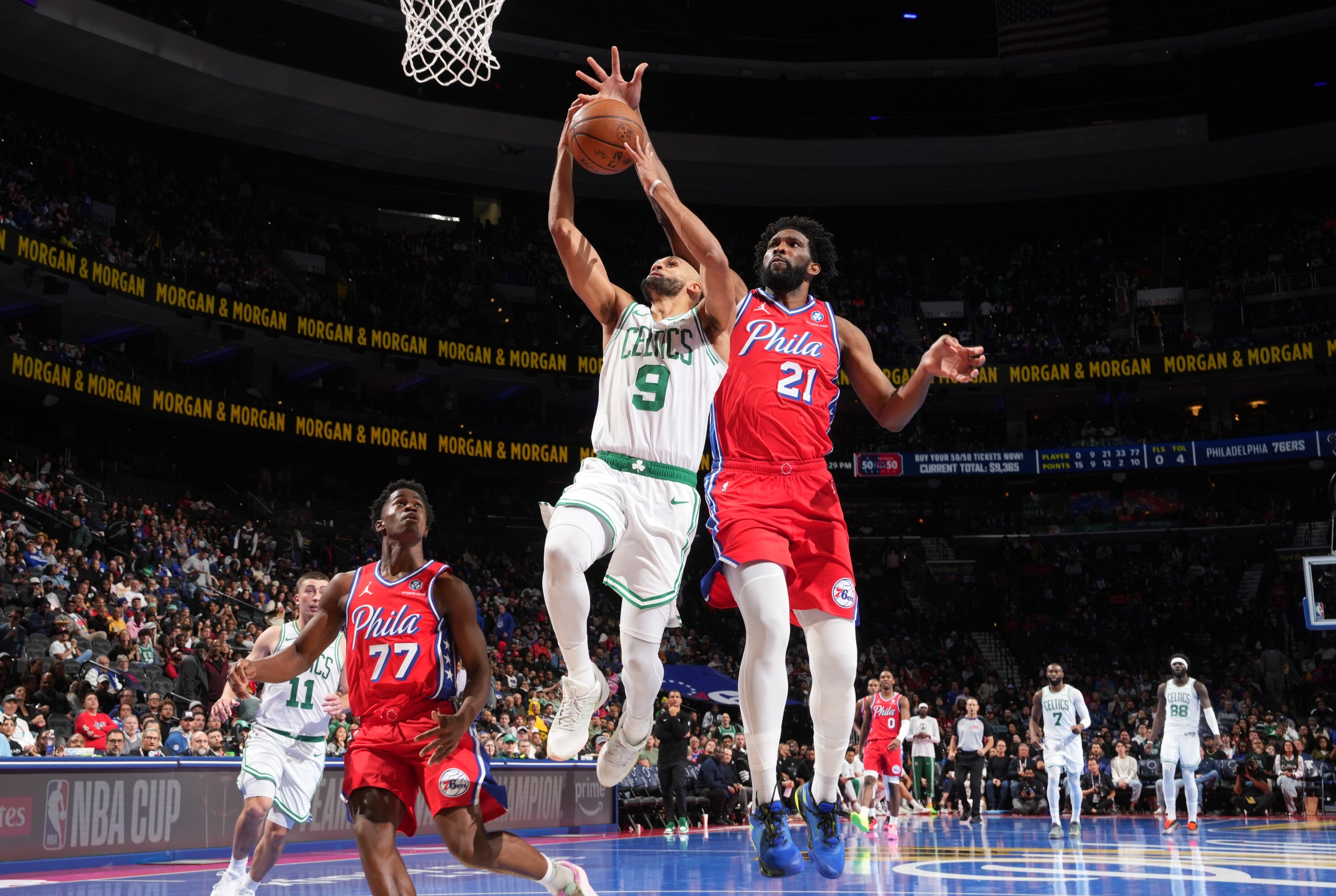 PHILADELPHIA, PA - OCTOBER 31: Joel Embiid #21 of the Philadelphia 76ers blocks the shot of Derrick White #9 of the Boston Celtics drives to the basket during the game during the 2025-26 Emirates Cup on October 31, 2025 at the Wells Fargo Center in Philadelphia, Pennsylvania NOTE TO USER: User expressly acknowledges and agrees that, by downloading and/or using this Photograph, user is consenting to the terms and conditions of the Getty Images License Agreement. Mandatory Copyright Notice: Copyright 2025 NBAE (Photo by Jesse D. Garrabrant/NBAE via Getty Images)