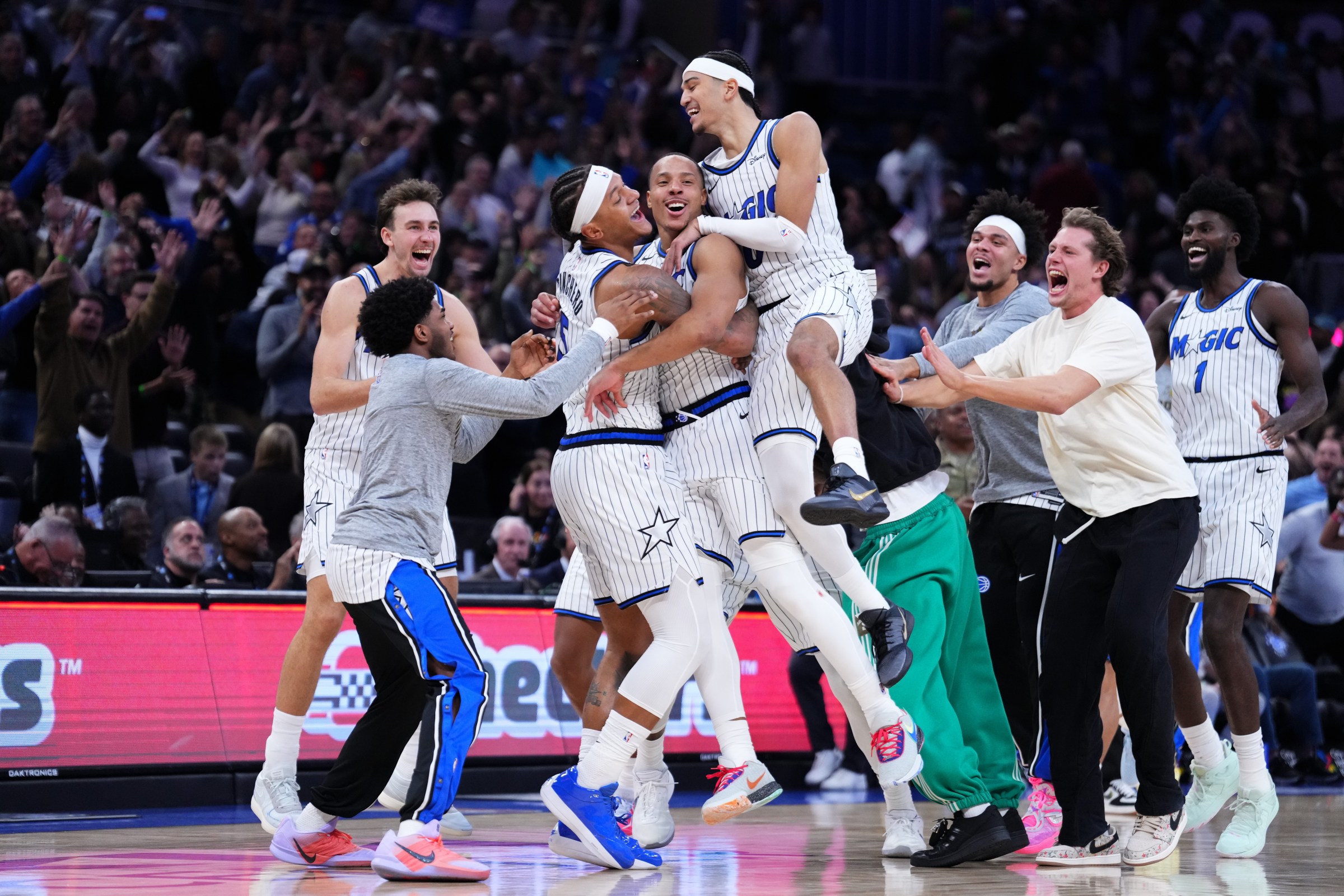 ORLANDO, FLORIDA - NOVEMBER 10: Desmond Bane #3 of the Orlando Magic celebrates with teammates after scoring the game winning shot at the buzzer against the Portland Trail Blazers during the fourth quarter at Kia Center on November 10, 2025 in Orlando, Florida. NOTE TO USER: User expressly acknowledges and agrees that, by downloading and or using this photograph, User is consenting to the terms and conditions of the Getty Images License Agreement. (Photo by Rich Storry/Getty Images)