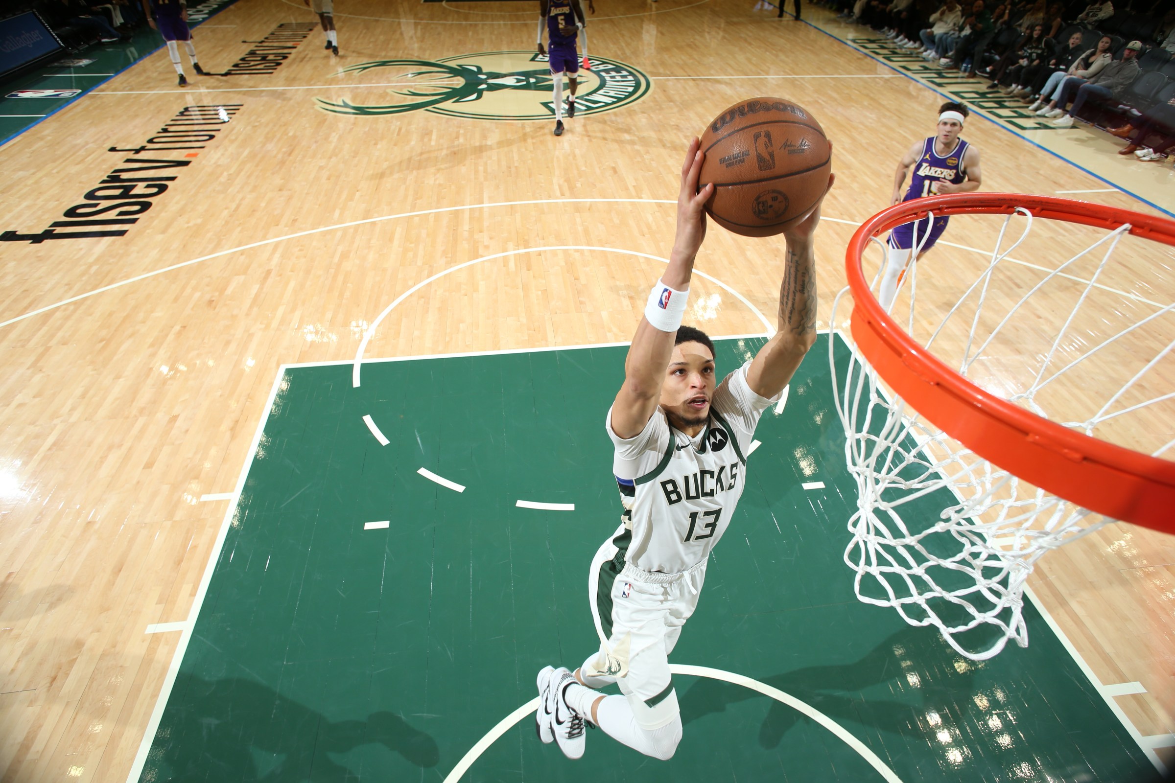 MILWAUKEE, WI - NOVEMBER 15: Ryan Rollins #13 of the Milwaukee Bucks dunks the ball during the game against the Los Angeles Lakers on November 15, 2025 at Fiserv Forum Center in Milwaukee, Wisconsin. NOTE TO USER: User expressly acknowledges and agrees that, by downloading and or using this Photograph, user is consenting to the terms and conditions of the Getty Images License Agreement. Mandatory Copyright Notice: Copyright 2025 NBAE (Photo by Gary Dineen/NBAE via Getty Images).