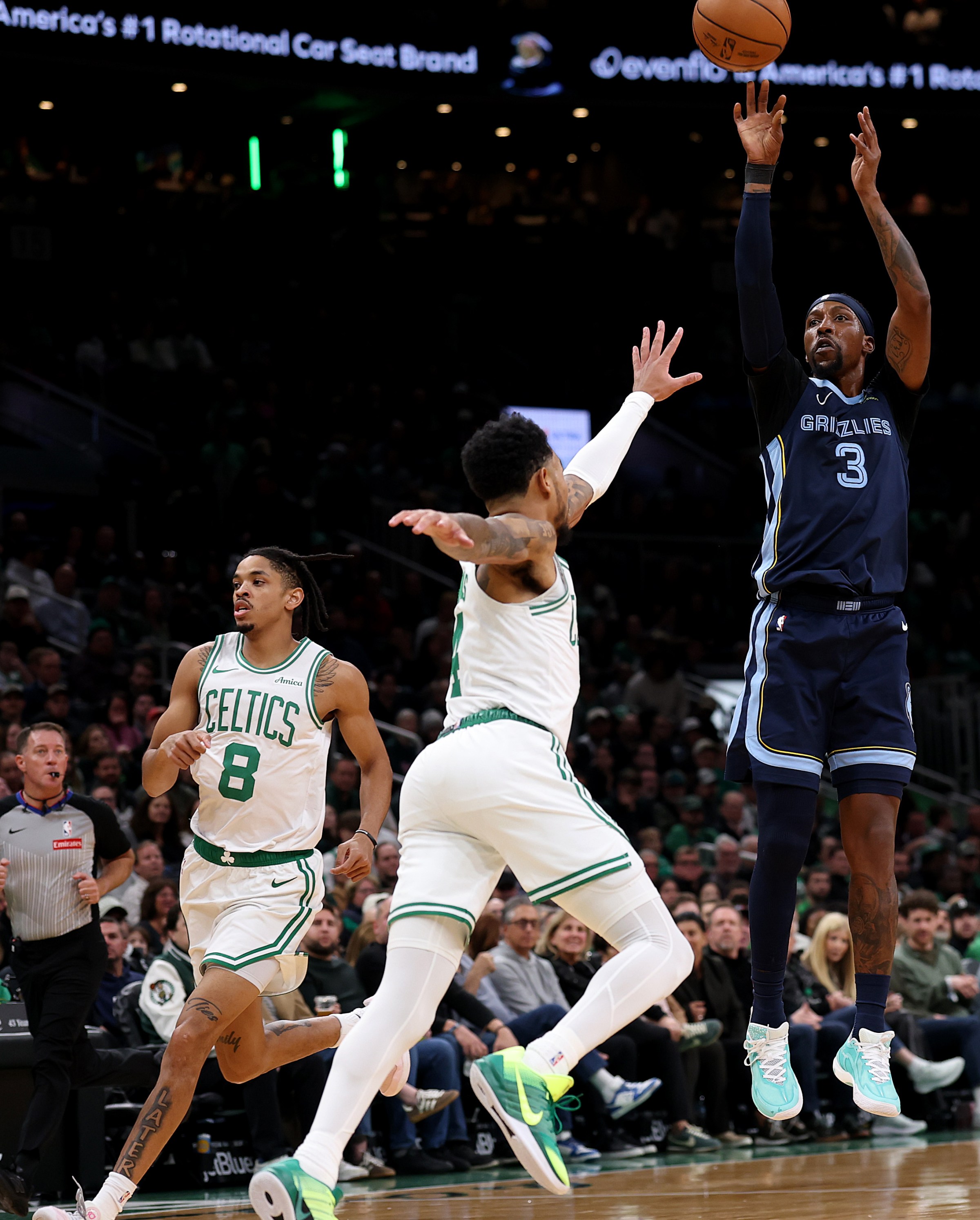 BOSTON, MASSACHUSETTS - NOVEMBER 12: Kentavious Caldwell-Pope #3 of the Memphis Grizzlies takes a shot against Anfernee Simons #4 of the Boston Celtics during the first quarter at TD Garden on November 12, 2025 in Boston, Massachusetts. NOTE TO USER: User expressly acknowledges and agrees that, by downloading and or using this photograph, user is consenting to the terms and conditions of the Getty Images License Agreement. (Photo by Maddie Meyer/Getty Images)