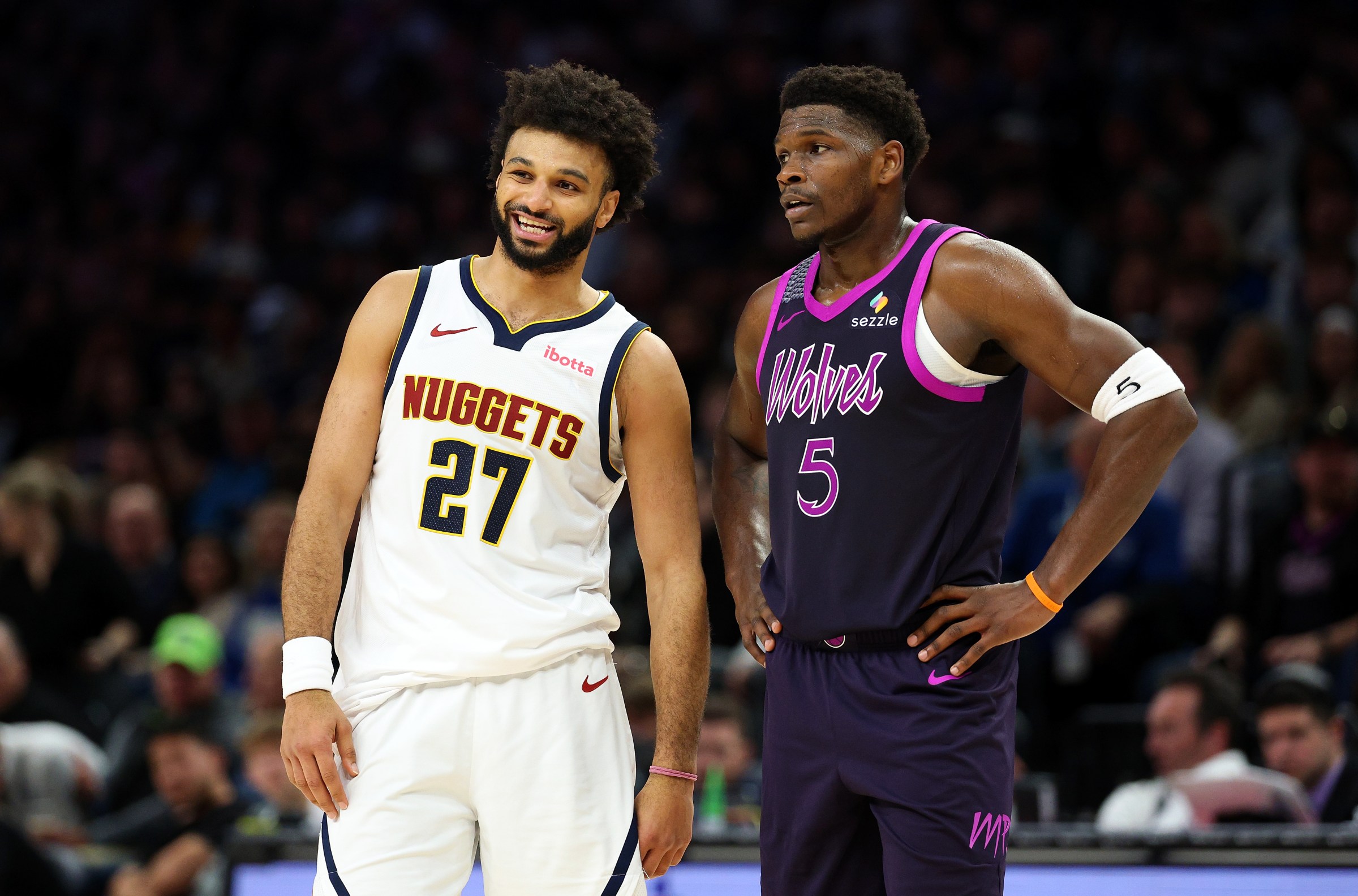 MINNEAPOLIS, MINNESOTA - NOVEMBER 15: Jamal Murray #27 of the Denver Nuggets interacts with Anthony Edwards #5 of the Minnesota Timberwolves in the third quarter at Target Center on November 15, 2025 in Minneapolis, Minnesota. The Nuggets defeated the Timberwolves 123-112. NOTE TO USER: User expressly acknowledges and agrees that, by downloading and or using this photograph, User is consenting to the terms and conditions of the Getty Images License Agreement. (Photo by David Berding/Getty Images)