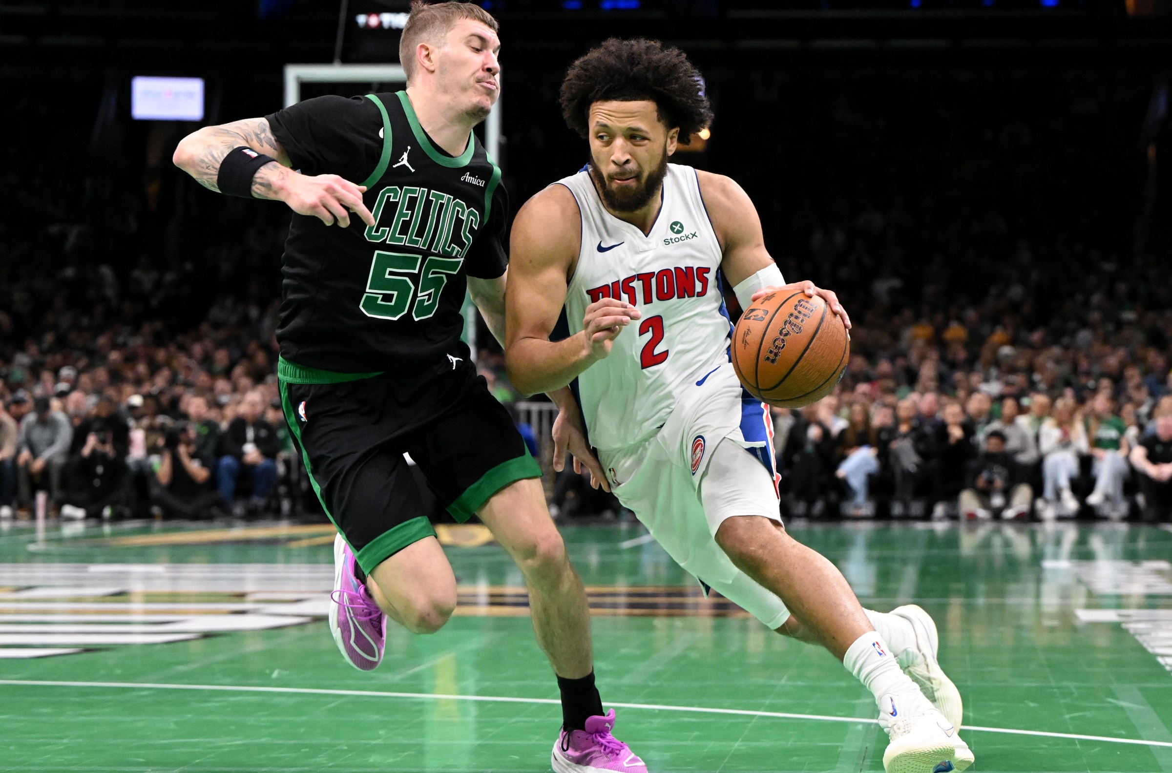 BOSTON, MASSACHUSETTS - NOVEMBER 26: Cade Cunningham #2 of the Detroit Pistons goes to the basket against Baylor Scheierman #55 of the Boston Celtics during the first half at the TD Garden on November 26, 2025 in Boston, Massachusetts. NOTE TO USER: User expressly acknowledges and agrees that, by downloading and or using this photograph, User is consenting to the terms and conditions of the Getty Images License Agreement. (Photo by Brian Fluharty/Getty Images)