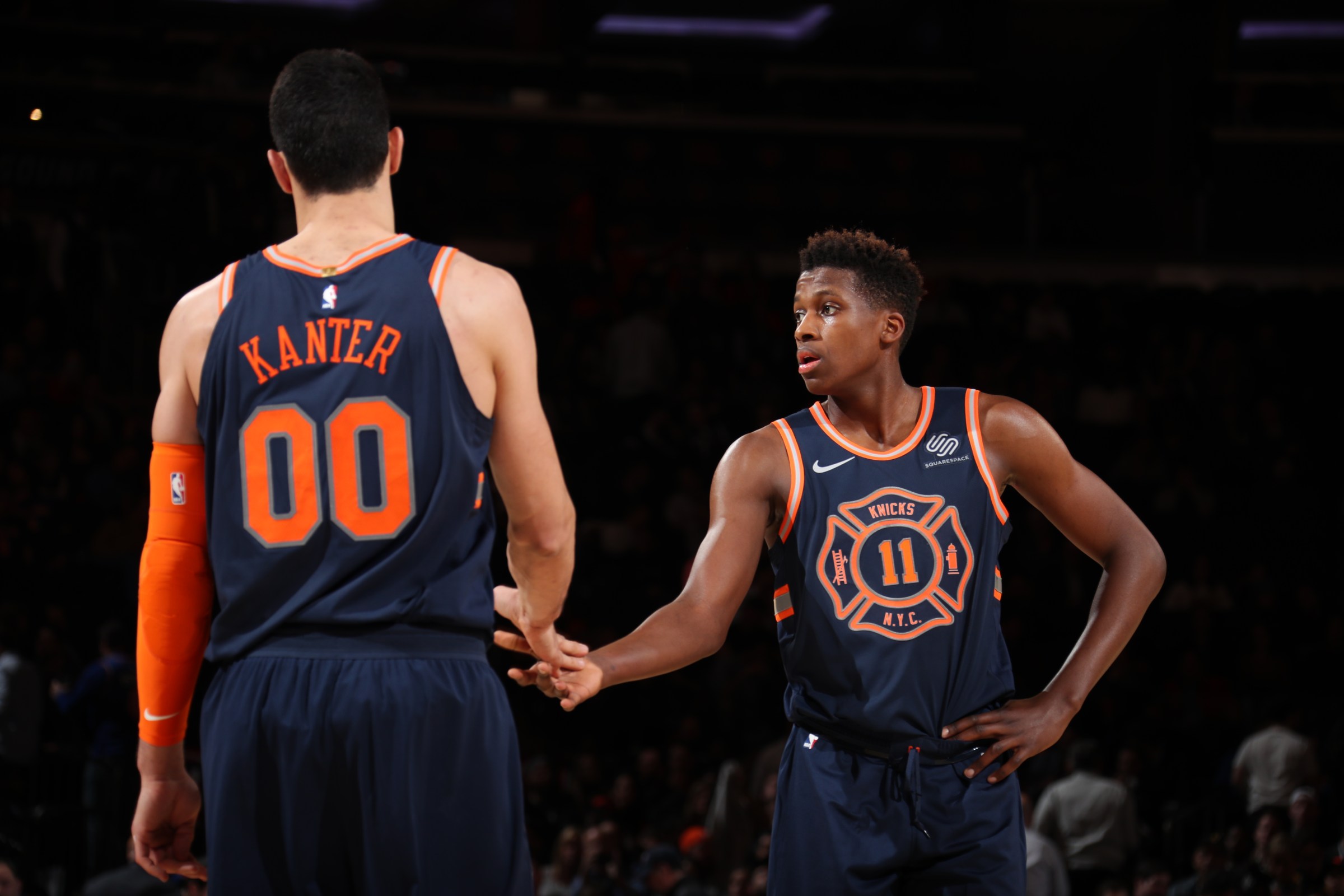 NEW YORK, NY - JANUARY 30: Frank Ntilikina #11 and Enes Kanter #00 of the New York Knicks high five during the game against the Brooklyn Nets on January 30, 2018 at Madison Square Garden in New York City, New York. NOTE TO USER: User expressly acknowledges and agrees that, by downloading and or using this photograph, User is consenting to the terms and conditions of the Getty Images License Agreement. Mandatory Copyright Notice: Copyright 2018 NBAE (Photo by Nathaniel S. Butler/NBAE via Getty Images)