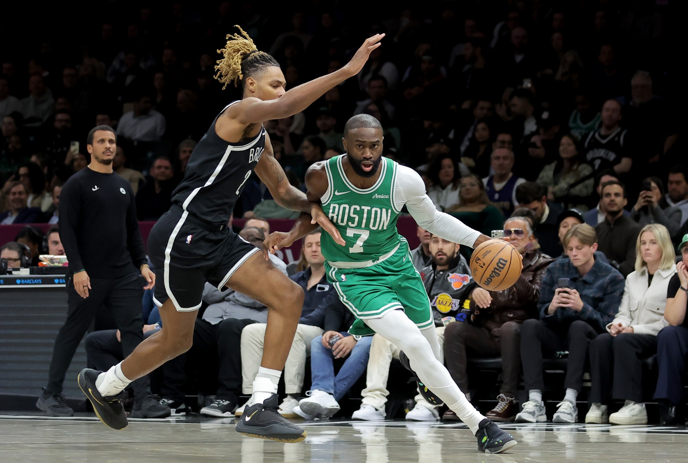 Nov 18, 2025; Brooklyn, New York, USA; Boston Celtics guard Jaylen Brown (7) drives to the basket against Brooklyn Nets forward Noah Clowney (21) during the first quarter at Barclays Center. Mandatory Credit: Brad Penner-Imagn Images