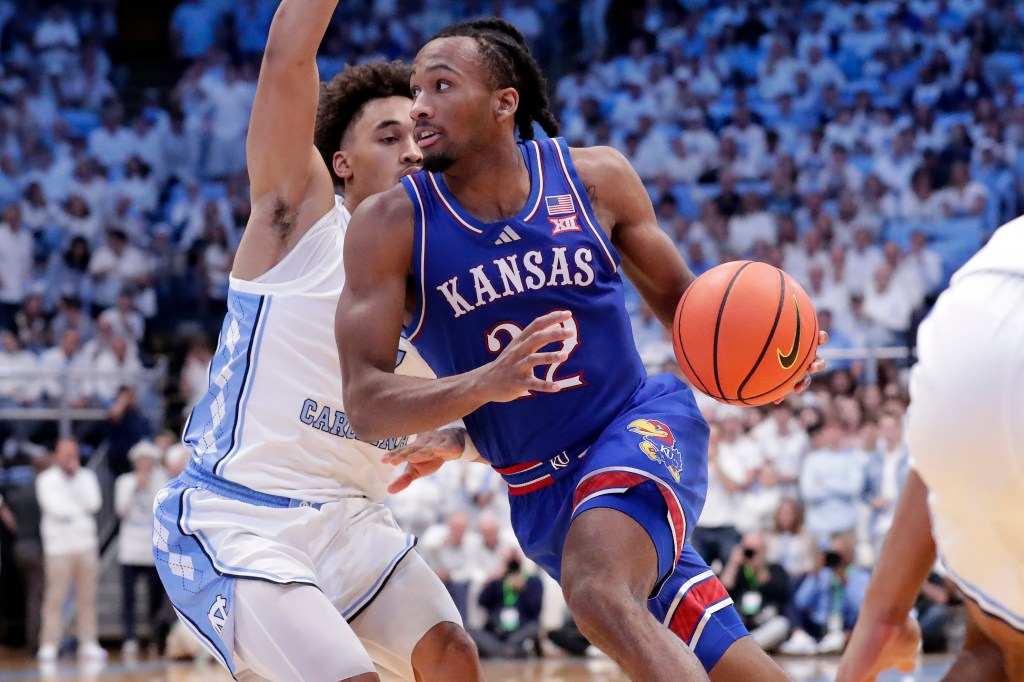 Kansas guard Darryn Peterson, right, drives against North Carolina guard Seth Trimble.