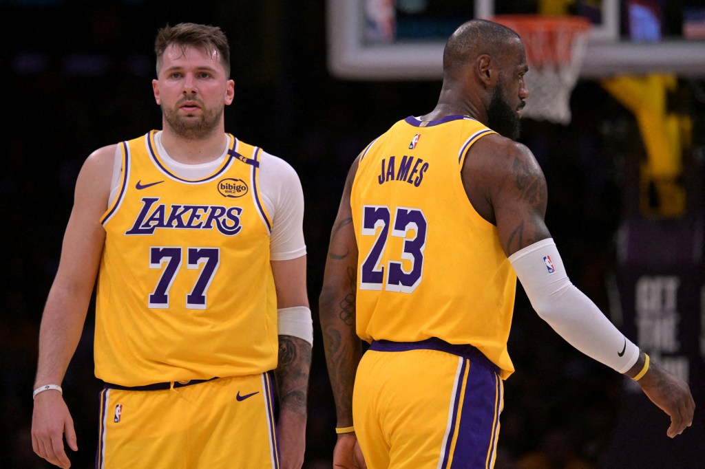 Los Angeles Lakers players Luka Doncic and LeBron James on court.