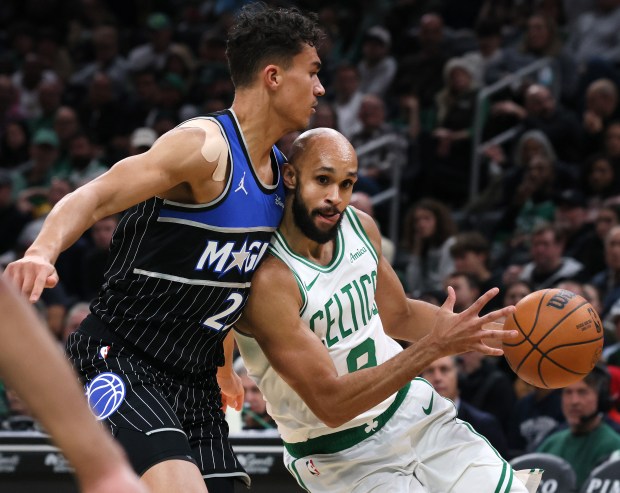 Boston Celtics guard Derrick White drives past Orlando Magic's Tristan da Silva during the third quarter at the TD Garden. (Nancy Lane/Boston Herald)