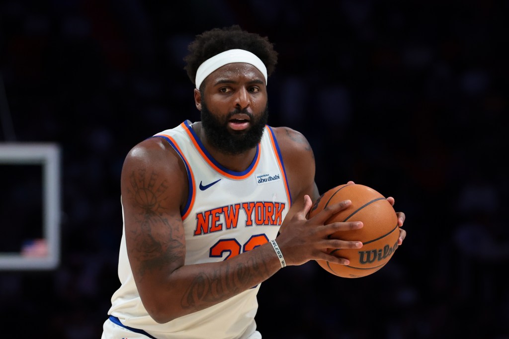 New York Knicks center Mitchell Robinson (23) protects the basketball against the Miami Heat.