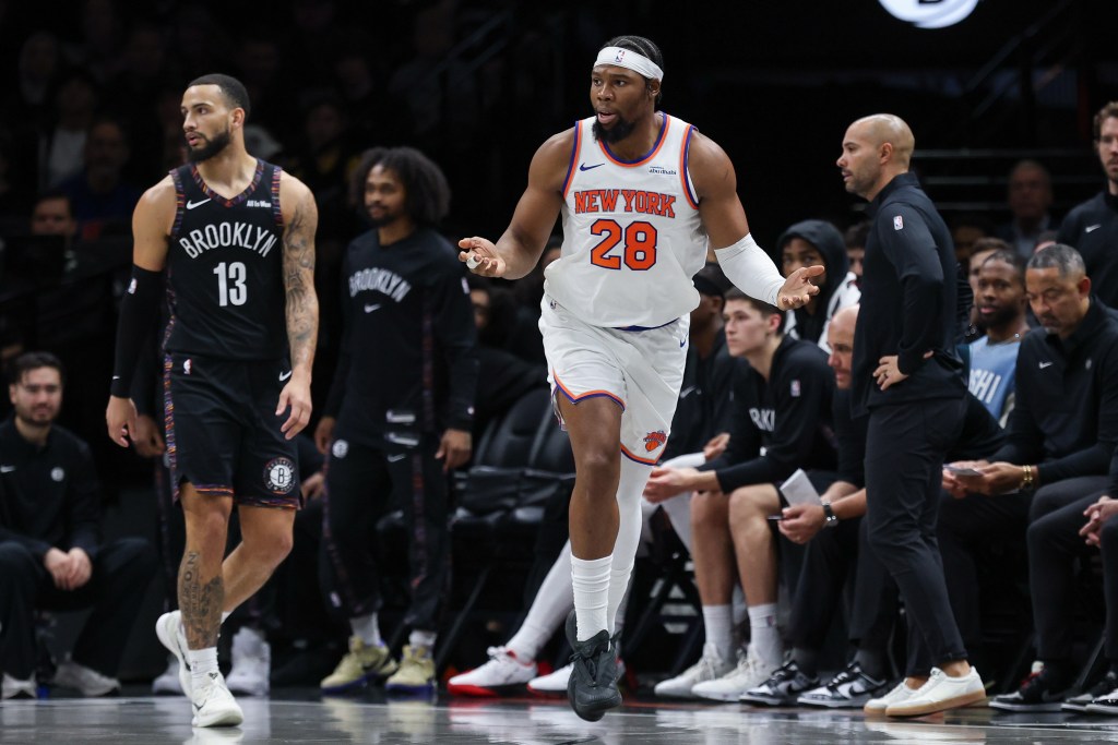 New York Knicks forward Guerschon Yabusele (28) reacts in front of Brooklyn Nets guard Tyrese Martin (13).Knicks forward Guerschon Yabusele (28) reacts in front of Brooklyn Nets guard Tyrese Martin